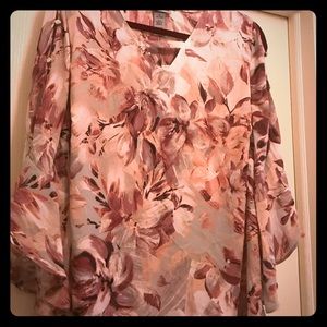 Cute top with shoulder cutouts & rhinestone detail